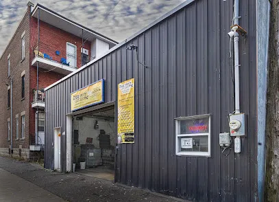 Façade du garage Diaz 911 sur la rue Caisse